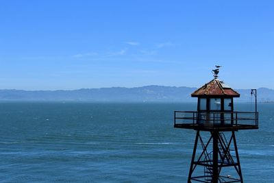 Scenic view of sea against blue sky