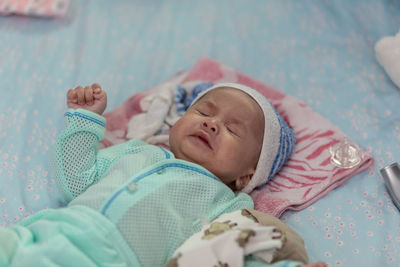 Cute baby sleeping on bed