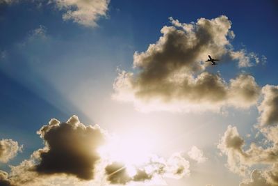 Low angle view of airplane flying in sky