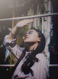 Portrait of a young woman with eyes closed