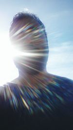 Close-up of man against blue background