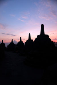 Silhouette of temple against sky during sunset