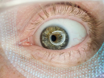 Close up of human eyeball and lashes with interesting light play