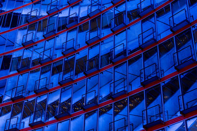 Low angle view of modern glass building in city