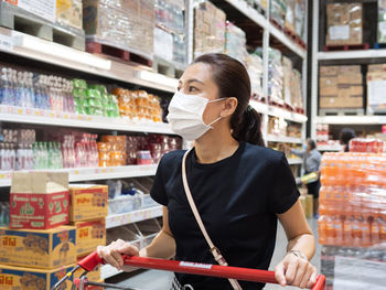 Full length of woman holding ice cream store