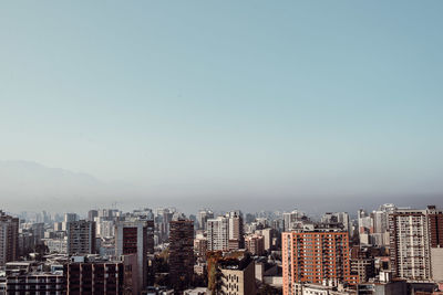 View of cityscape against clear sky