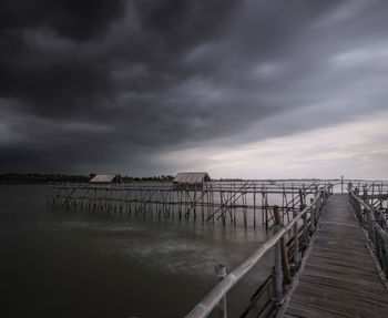 Pier over sea against sky
