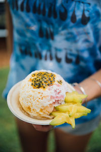 Close-up of hand holding ice cream