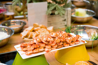 Shrimp kebabs on skewers on the festive table. appetizer set on the catering table
