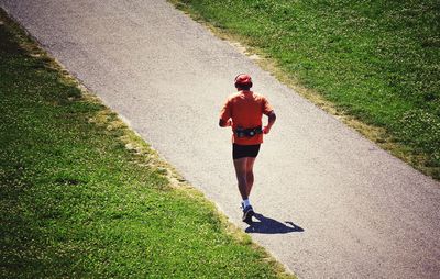 Woman walking on road