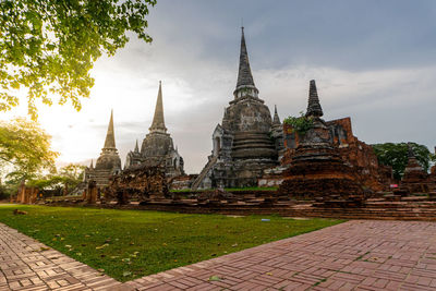 Old temple building against sky