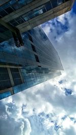 Low angle view of building against cloudy sky