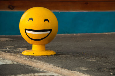 Close-up of smiley face on swimming pool