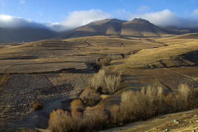 Scenic view of rocky mountains against sky