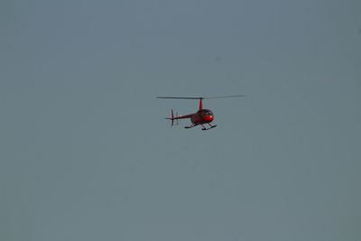 Low angle view of airplane against clear sky