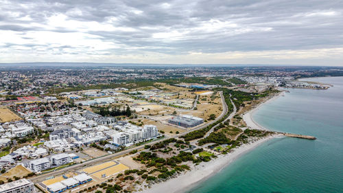 High angle view of townscape by sea