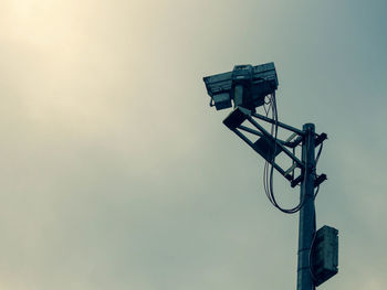 Low angle view of street light against sky