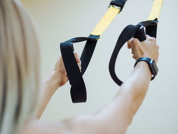 Cropped hand of woman holding thermometer