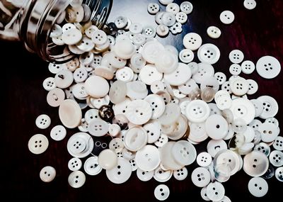 High angle view of buttons on table