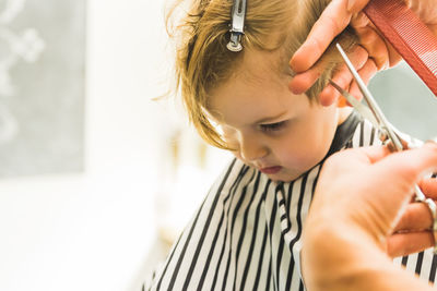 Boy getting haircut