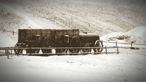 Horse cart on field during winter
