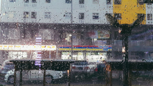 Full frame shot of wet window in rainy season