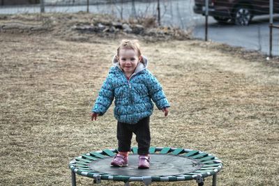 Portrait of smiling girl standing in winter