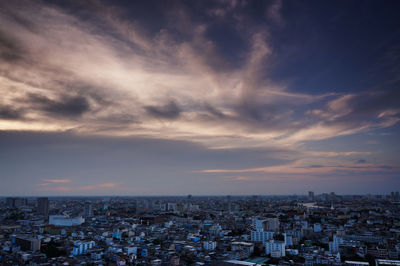 High angle view of city at sunset