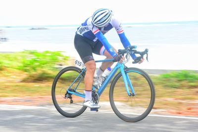 Man riding bicycle in sea