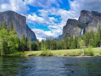 Scenic view of lake and mountains against sky