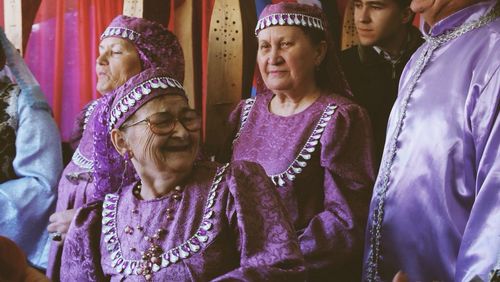Smiling girl with arms raised