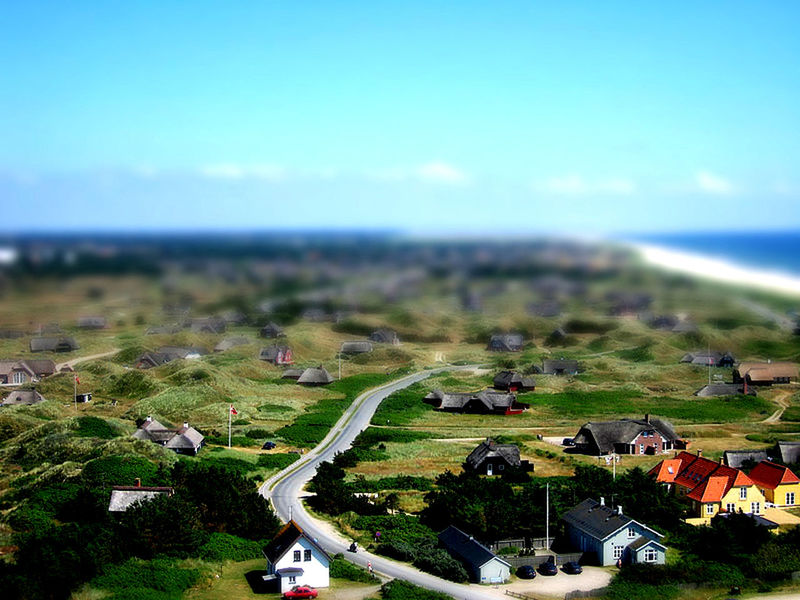 landscape, clear sky, horizon over water, sea, scenics, blue, grass, copy space, nature, sky, beauty in nature, transportation, tranquil scene, high angle view, field, tranquility, horizon over land, day, mode of transport