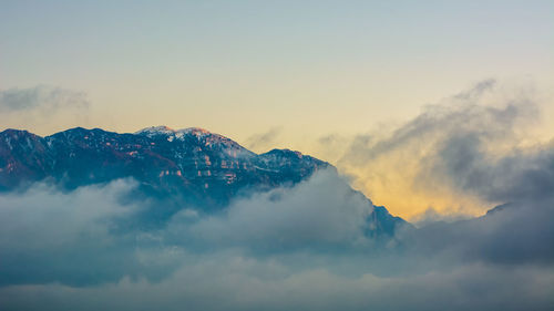 Low angle view of mountains against sky during sunset