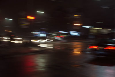 Blurred motion of car on street at night