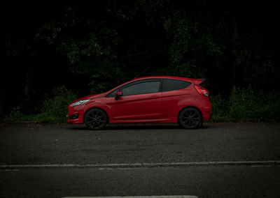 Red car parked on street