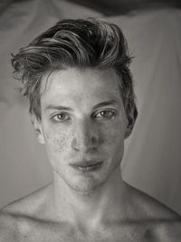 Close-up portrait of man with freckles