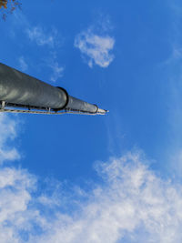 Low angle view of airplane flying in sky