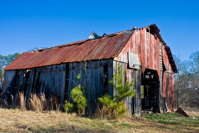 Exterior of old building against clear blue sky