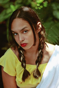 Portrait of serious teenage girl with braided hair