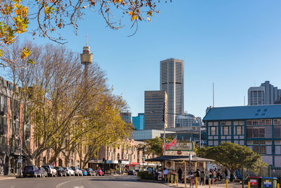 City street and buildings against sky