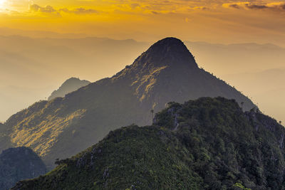 Scenic view of mountains against sky during sunset