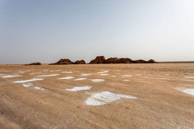 Scenic view of beach against clear sky