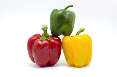 Close-up of bell peppers against white background