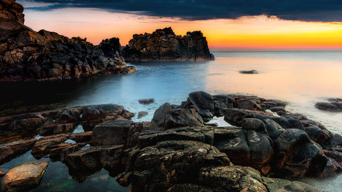 Scenic view of sea against sky during sunset