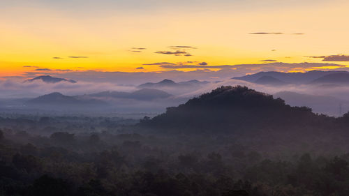 Scenic view of mountains against sky during sunset