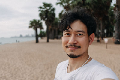 Portrait of young man on beach