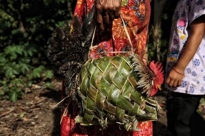 Low section of woman standing on display at market