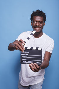 Portrait of young man using mobile phone