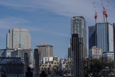 Skyscrapers in city against sky