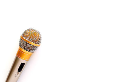 High angle view of microphone against white background